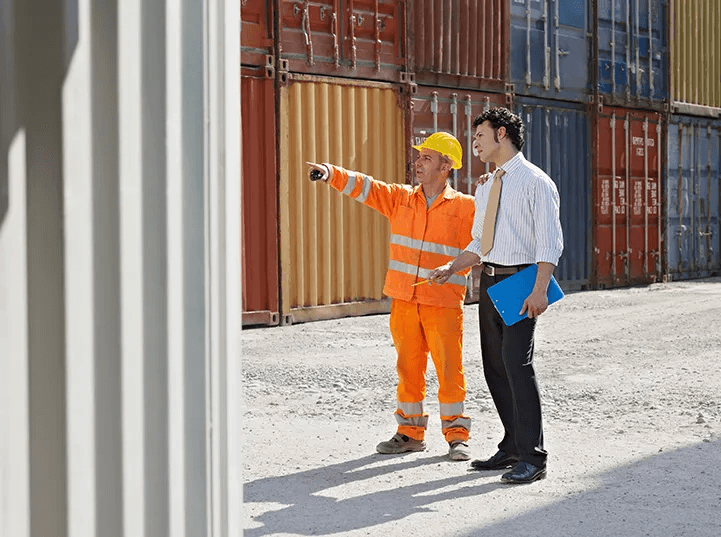 Business professionals reviewing trade compliance documents